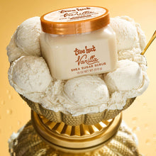 Tree Hut Vanilla Shea Sugar Scrub jar with thick creamy scrub scoops around it