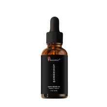 Leave-in beard and hair oil bottle with amber liquid and black ribbed cap