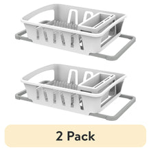 White dish drying rack with utensil holder, plate slots, and countertop drainer