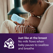 Blue Philips Avent baby bottle with Natural Response nipple during breastfeeding-style feeding