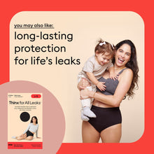 Women’s black leakproof period brief with short-sleeve top, holding child