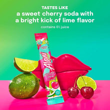 Cherry twist energy drink mix stick beside lime slices, cherries, and mock drink