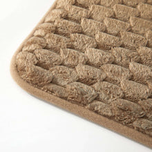 Taupe/brown bubble bath rug edge with ribbed border and raised textured loops