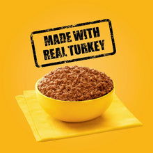 Made with real turkey label over turkey & bacon wet dog food texture