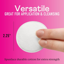 White cotton facial round held by fingertips with 2.25 inch size marker