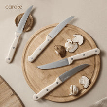 Knife set on round bamboo board with five stainless knives and wooden handles