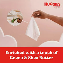 Huggies Nourish baby wipes pouch held up, enriched with cocoa and shea butter