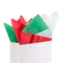 Colorful wrapping tissue sheets in red, green, and white