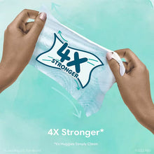 Baby wipes pouch held by hands with 4X stronger badge graphic