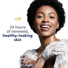Dove pampering body wash featuring smiling woman with foam on shoulders and towel