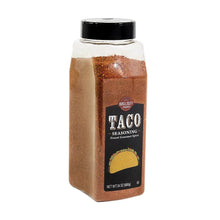 Wellsley Farms taco seasoning jar with black lid; brown spice blend in angled view