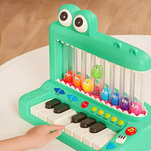 Green crocodile pop piano toy keyboard with character drums and blue volume buttons