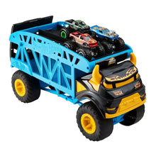 Blue toy monster truck with open bed holding four mini monster cars, yellow wheel rims