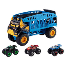 Blue toy monster truck with open bed and yellow wheel rims, three mini monster cars