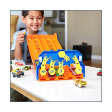 Hot Wheels Roll Out Raceway track set on table with orange ramp and blue launcher