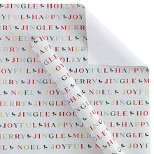 Dark holiday wrapping paper with repeating words “JINGLE,” “NOEL,” and “JOYFUL”