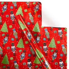 Red wrapping paper with repeating nutcracker soldiers and green Christmas trees
