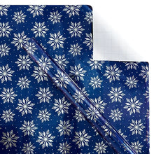 Winter wrapping paper sheet with blue snowflake pattern and folded crease