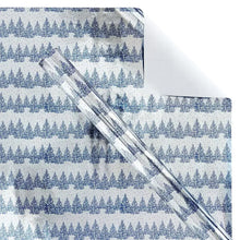Winter wrapping paper sheet with blue forest landscape and diagonal border stripe