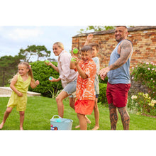 Reusable water balloons, children holding bright green and orange balloons by a pool