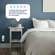 Bedside scene with Febreze Plug device on a wall outlet