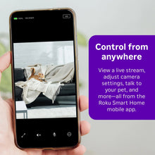 Roku indoor camera streaming on a smartphone held in hand