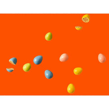 Colorful candy pieces in blue, green, yellow, and pink