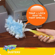 Cleaning duster with blue head and yellow handle, reaching into tight appliance spaces