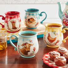 Stoneware mug set on table: red, teal, yellow, and blue mugs with animal graphics