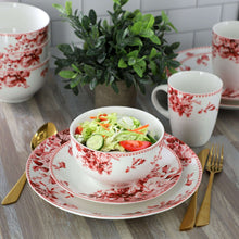 Stoneware bowl, plate, and mugs with red rose floral pattern on white