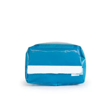 Blue coffee bag with white label band, sealed packaging