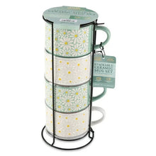 Stacking ceramic mugs set with white and green floral pattern, in black wire rack