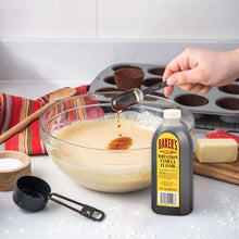 Baker's imitation vanilla flavor bottle beside a mixing bowl with vanilla batter