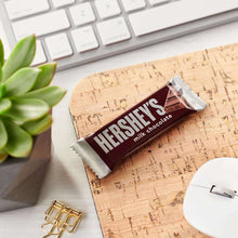 Hershey's milk chocolate snack bar on cork coaster with foil wrapper