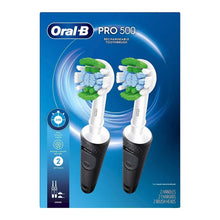 Oral-B Pro 500 electric toothbrush set with two black handles and brush heads