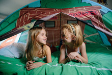 Treehouse pop-up play tent with blue base and green roof, two children inside