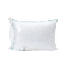 White quilted memory foam pillow with blue edge piping and small back label