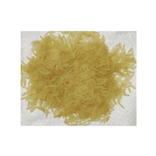 Golden basmati-style rice grains, long uncooked kernels in a heap