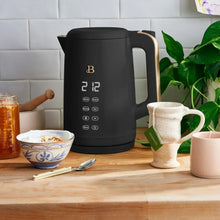 Electric kettle, black with gold accents, digital control panel and temperature display