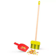 Wooden dustpan and yellow scrub brush with standing broom handle