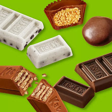 Assorted Hershey's chocolate candies and bars with visible pieces and bites