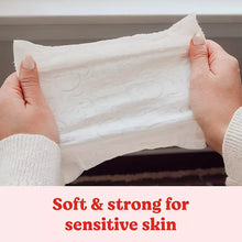 Soft baby wipe sheet pulled from the pack between hands