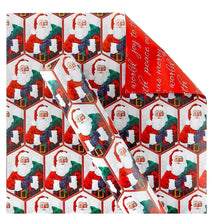 Reversible Christmas gift wrap with Santa in hexagon pattern and red cursive text