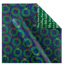 Christmas gift wrap sheet with wreath and bow pattern on dark purple