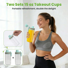 Two 15 oz takeout blender cups with lids and teal portable blender base