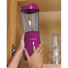 Raspberry personal blender with clear blending cup and lid, held by two hands