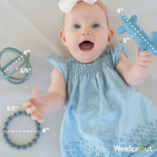Baby holding teal silicone teether set with ring and beaded teether