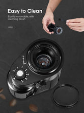 Electric coffee burr grinder with removable grinder chamber shown, black and silver body