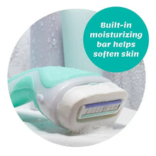 Razor with built-in moisturizing bar, white handle and teal accents in shaving foam.