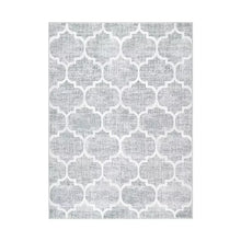 Gray area rug with white quatrefoil lattice pattern, flat woven style